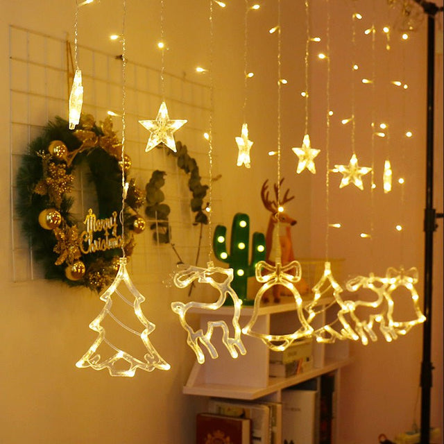 Instalatie craciun perdea luminoasa cu figurine brazi, reni si clopotei, 4m, alb cald - BUZ.RO