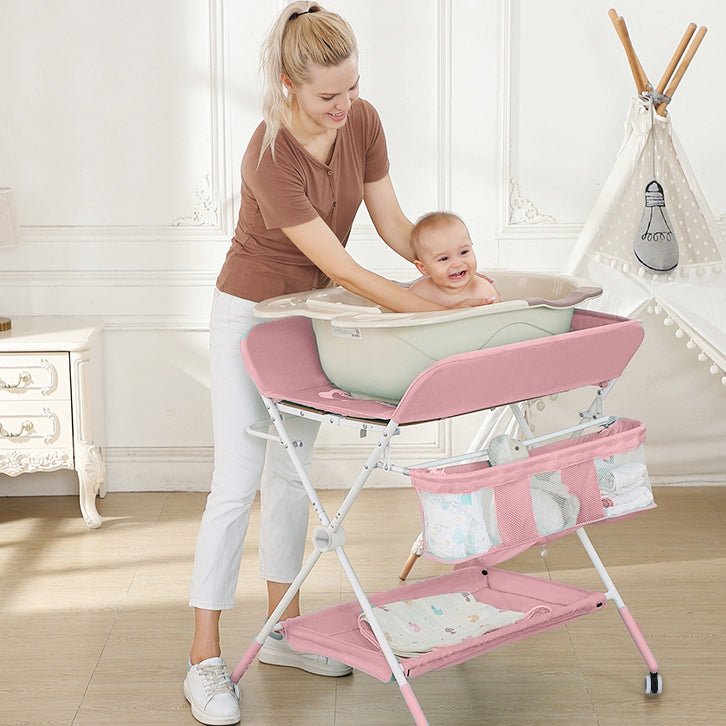 Masa de infasat si schimbat scutecele, multifunctionala, pliabila, cu cos de depozitare, roz, 77x 59 cm - BUZ.RO